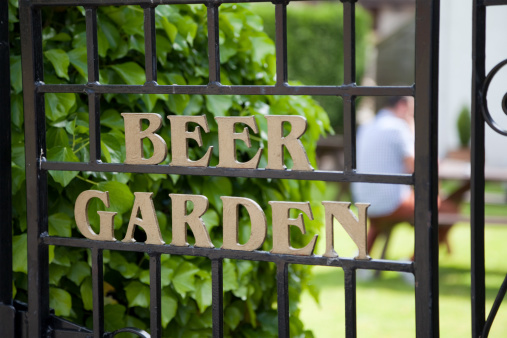 Sign on the gate leading to the beer garden in a British pub