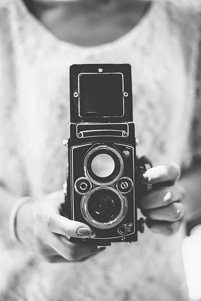 istock Young Woman with Vintage Camera 181143294
