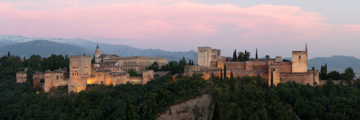 Panoramic view of Alhambra palace with snow-capped Sierra Nevada in the background, Granada, Spain. June, 2013. It was shot from Albaicin.