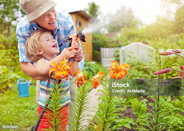 Grandmother And Grandson In The Garden Stock Photo - Download Image Now - Gardening, Summer, Yard - Grounds