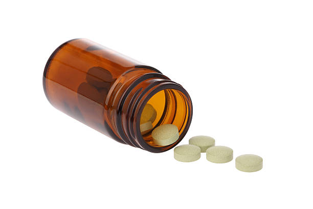 istock Medicine Spilling From an Open Bottle 181143776