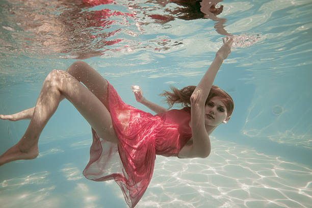 istock young woman underwater 181143911