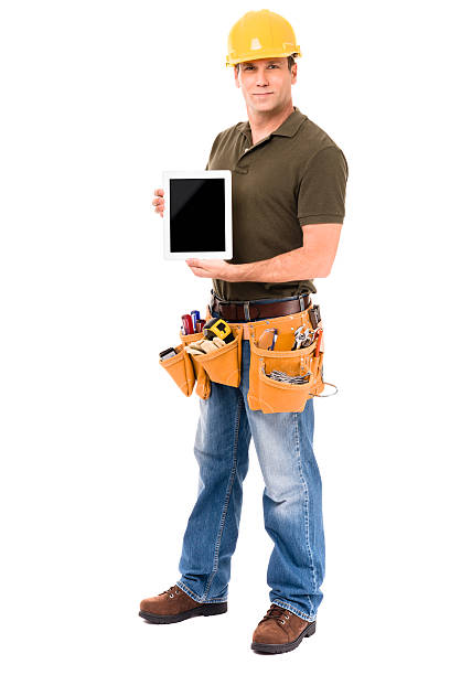 カーペンターの建設請負業者とデジタルタブレットで分離白背景 - construction worker digital tablet belt building contractor ストックフォトと画像