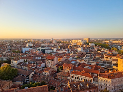 Toulouse is the 4th largest city in france,  its metropolitan area has a population of 1.5 million inhabitants. The image shows the beautiful city captured during autumn season at sunset.