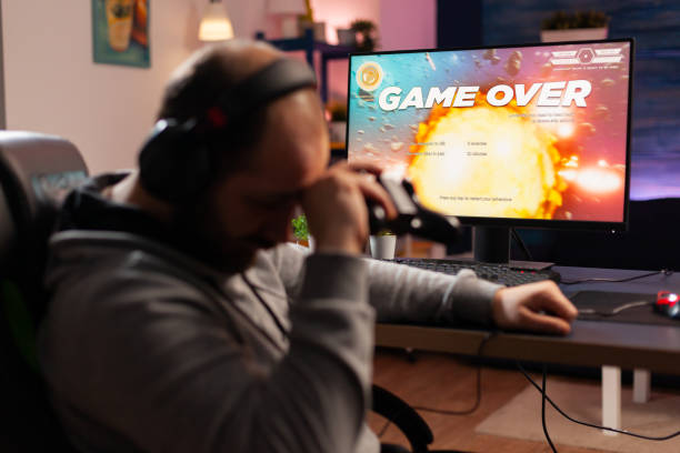 istock Addicted gamer losing space shooter videogam 1811441837