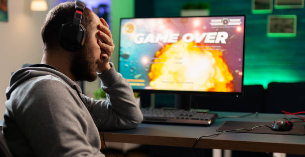istock Gamer with headset and microphone losing video games 1811442510