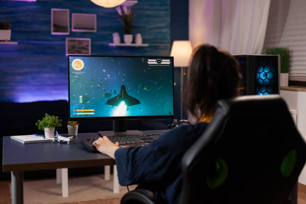 istock Focused player sitting on gaming chair in home studio 1811443958