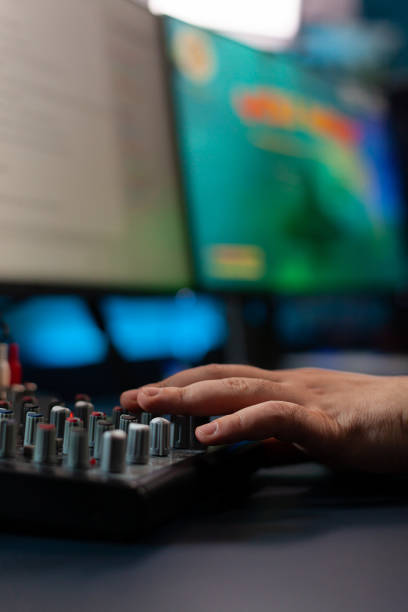 istock Close up of streamer checking mixer buttons 1811446251