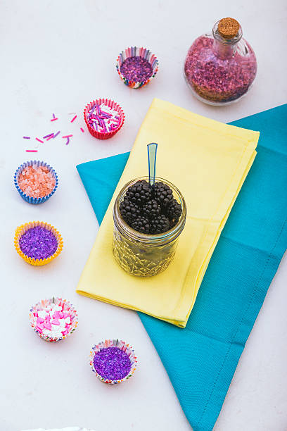 istock black berries in mason jar and  colored sugar 181144685