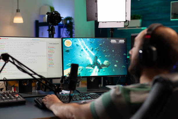 istock Streamer playing videogames and talking with teammates 1811447578