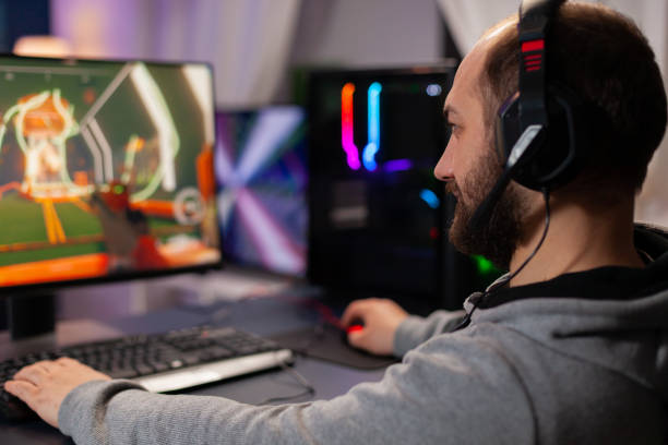 istock Digital player wearing headphones playing videogame 1811448712