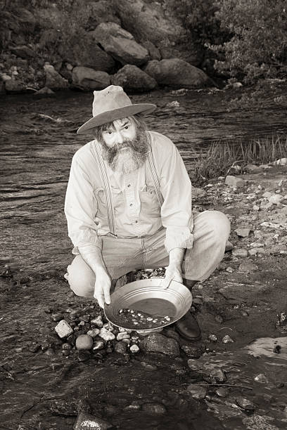 istock Man Panning For Gold In A Stream 181144964