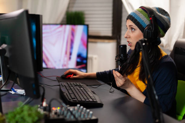 istock Caucasian pro streamer talking into professional microphone for virtual competition 1811453962
