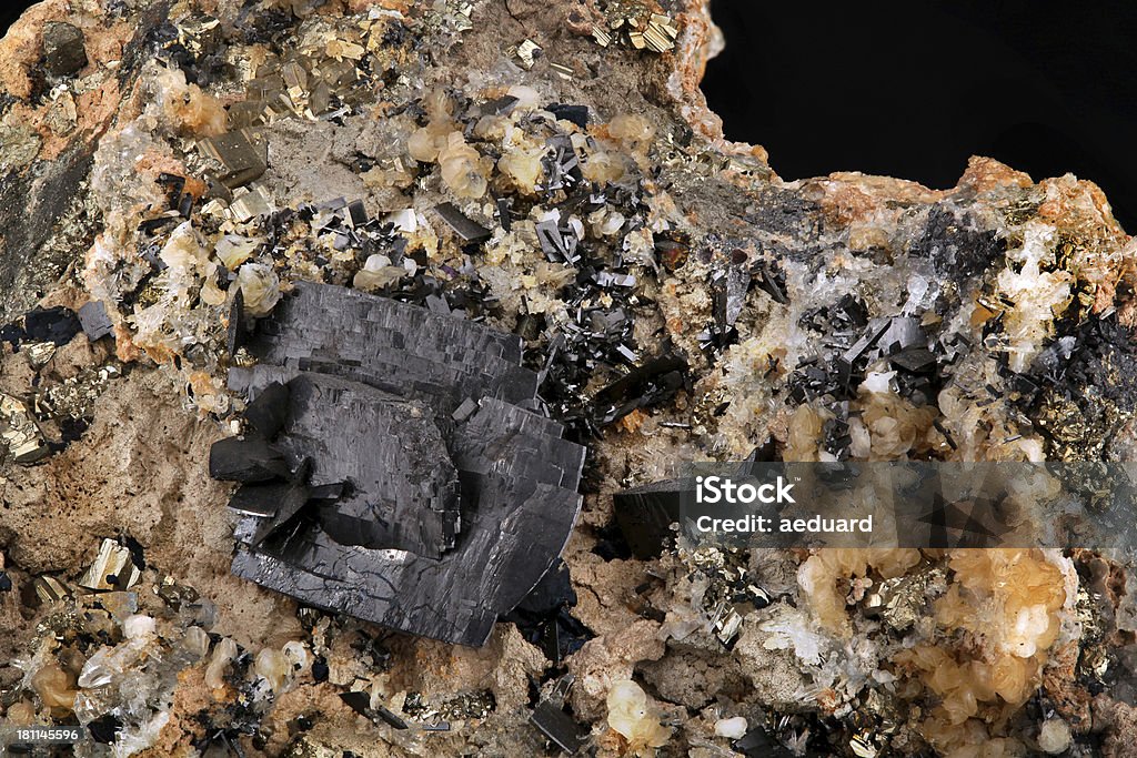 Wolframite Wolframite is an iron manganese tungstate mineral. Along with scheelite, the wolframite series are the most important tungsten ore minerals. Tungsten - Metal Stock Photo