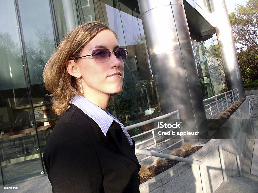 Business Woman and  Corporate Building 3 Business woman standing in front of corpoarte offices with confidence.Other similar images: Adult Stock Photo