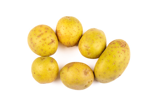 Vibrant Macro Shot of Fresh Yellow Potatoes on White Background | Farm-to-Table Culinary Delight