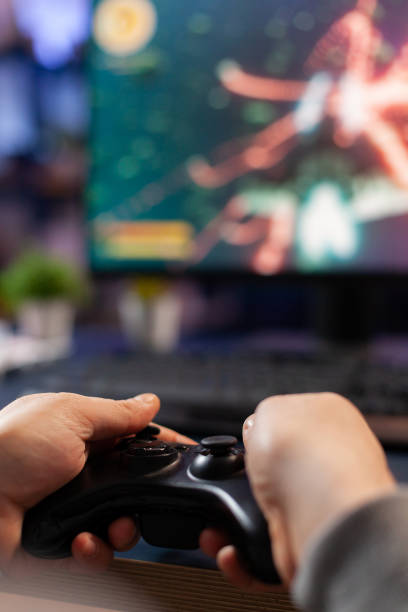 istock Close-up of competitive player holding joystick 1811456761