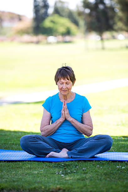 istock Senior Woman Practicing Yoga 181145716