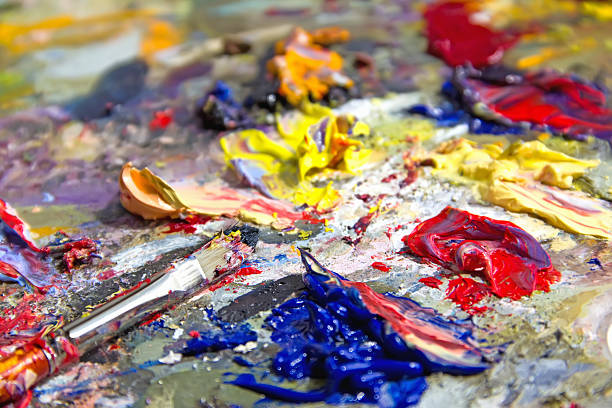 istock mixing oil paints with a brush 181145854