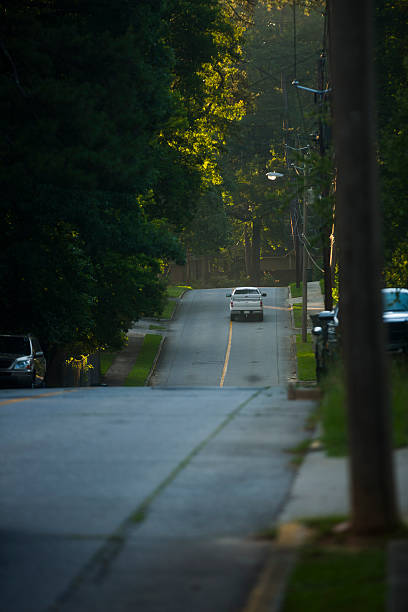 istock truck driving down the stree 181145994