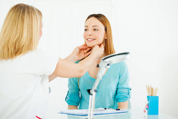 27 Female Doctor Touching Neck Of Teen Stock Photos, Pictures &  Royalty-Free Images - iStock