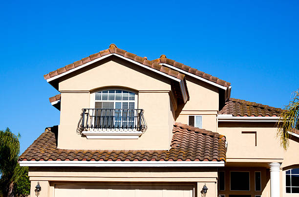istock Stucco Home Exterior and Blue Sky 181146137