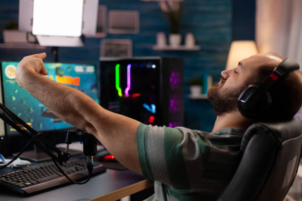 istock Excited player winning important online esport competition 1811465875