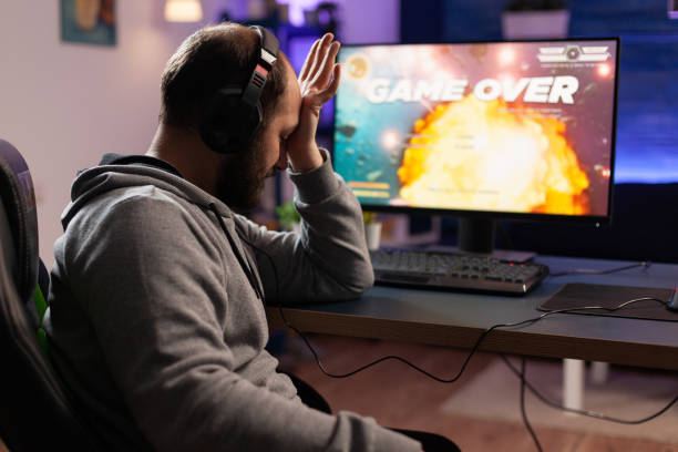 istock Sad gamer losing video games play on computer 1811470725