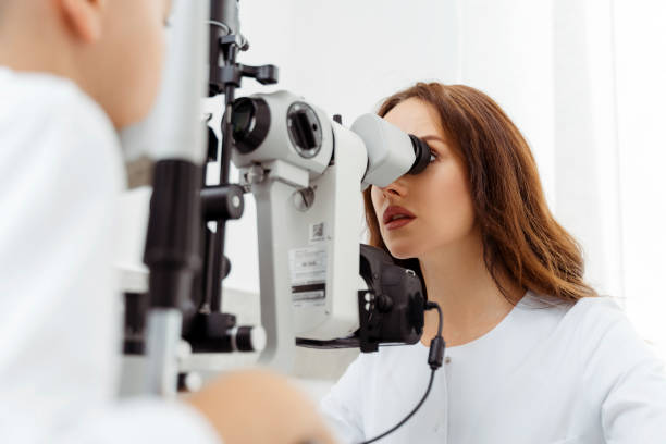 istock Young female doctor examining small boy patient 1811472491