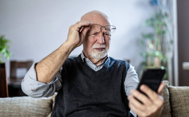 istock Senior man staring at his smartphone in confusion 1811477382