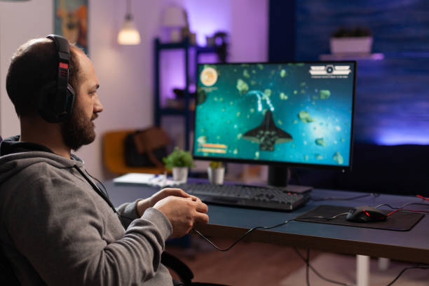 istock Person playing video games with joystick and headset 1811478077
