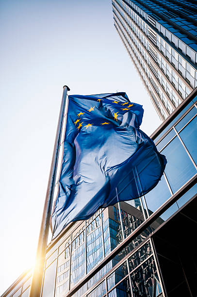Flag of the European Community - Frankfurt am Main Flag of the European Community in front of the Eurotower in Frankfurt am Main european union symbol stock pictures, royalty-free photos & images