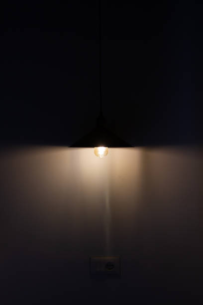 istock Incident light from a yellow lamp in a dark room 1811485032