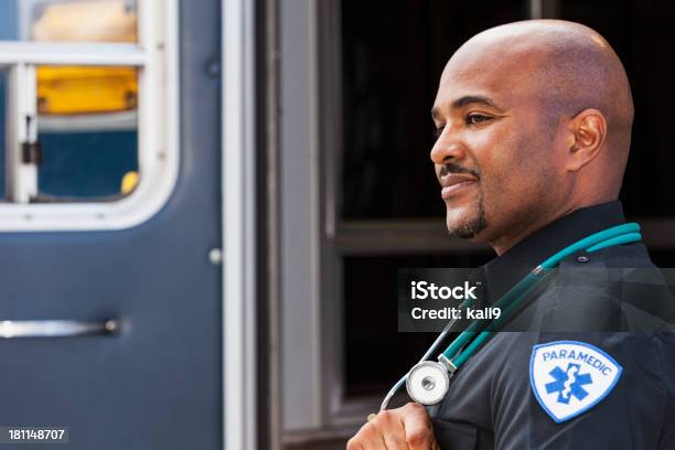 Paramedic Standing By Ambulance Stock Photo - Download Image Now - Paramedic, Occupation, Ambulance