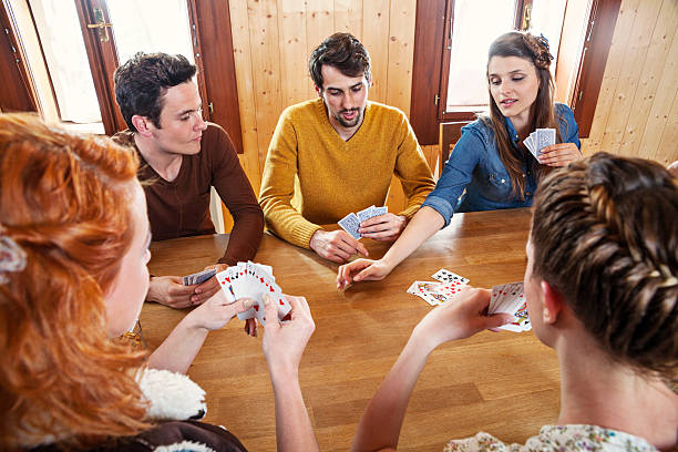 istock Group Of Friends Playing Cards 181148749