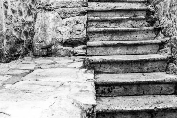 istock Background from historic stone staircase and stone paving for publication, design, poster, calendar, post, screensaver, wallpaper, postcard, banner, cover, website. Toned high quality photo 1811489980