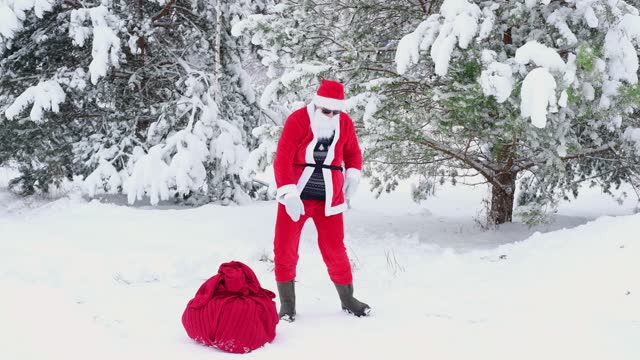 Santa Claus Dancing in a Winter Snow Forest. Active Cheerful Stylish Santa Claus Positively Dances, Haves Fun to Music Outdoors. Joyful Celebration Happy New Year, Merry Christmas Holidays Celebration