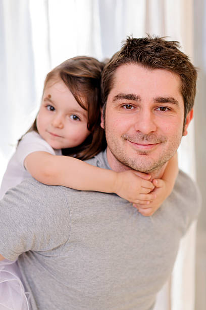 istock father carrying on shoulders his girl 181149326