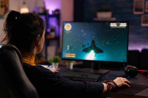 istock Adult using keyboard and mousepad to play video games 1811493378