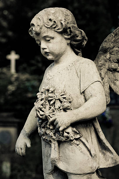 istock Cherub with white cross in the background 181149355