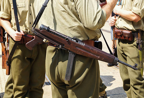 istock soldiers with old machine guns 181149866