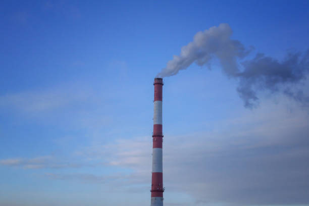 istock Environmental problem of city air pollution - Industrial construction cranes and building site over Steam and smoke emissions. 1811500136
