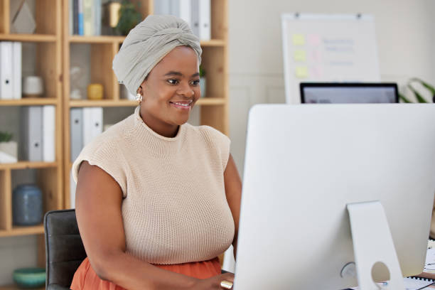 istock Business, online or black woman typing on computer working on search engine, email or project research. SEO technology, smile or happy African journalist writing blog reports or internet articles 1811500166