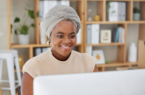 istock Business, smile or black woman typing on computer working on search engine or online project research. SEO technology, email or happy African journalist writing blog reports or internet articles 1811500169