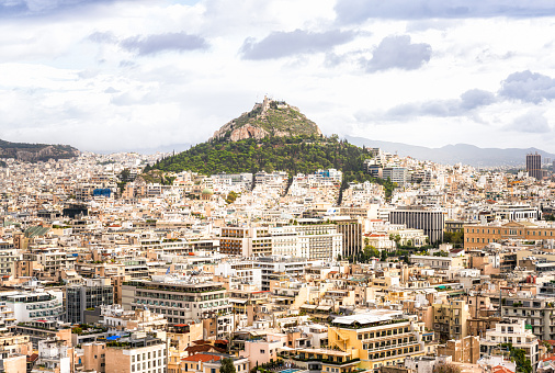 A view of Mount Lycabettus, from the high vantage point of the Acropolis, seen across part of the modern cityscape.