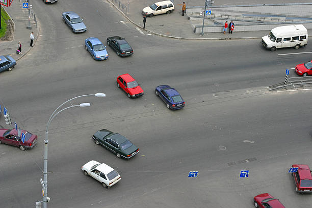 istock Overhead view of moving traffic at four-way intersection. 181150200