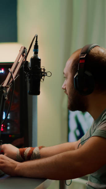 istock Competitive player streaming esport tournament checking sound mixer 1811506003