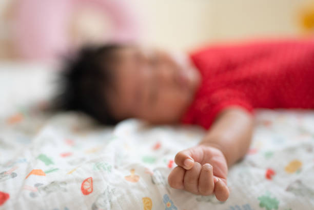 Hand of baby girl sleeping at day time stock photo