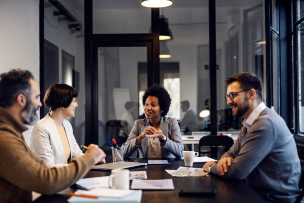 istock Small group of multicultural business people having briefing in the office. 1811507632