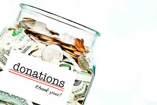 istock Donations Jar Filled with American Money 181150816